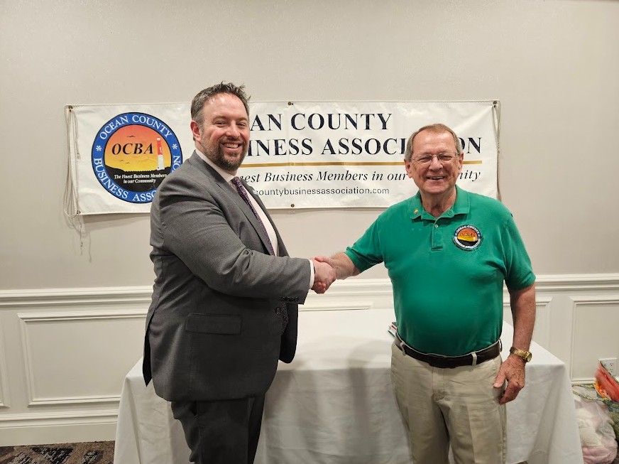 Chris Emigholz, Chief Government Affairs Officer (NJBIA) shakes hands with OCBA president Rich Gilchrest